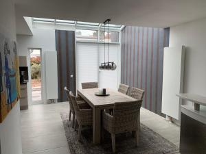 a dining room with a table and chairs at Wohnung in ruhiger Wohnlage in Bad Kreuznach +8 photos