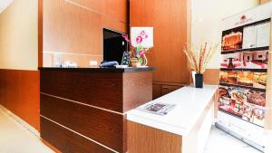 a office with a reception desk and a phone at Hotel Quds Express Syariah in Jakarta