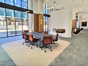 a conference room with a table and chairs at Stylish 1BR Getaway and Option for 2nd Br in Campbell +18 photos