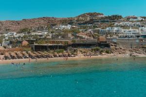 a view of a beach with people in the water at Tropicana Hotel Mykonos in Paradise Beach +75 photos