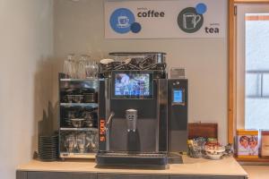 a coffee machine sitting on top of a counter at Brienz Youth Hostel in Brienz