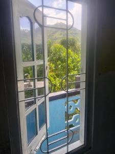 a window with a view of a mountain view at Friendship Villa-Ella in Nikawatawana