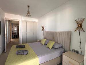 a bedroom with a bed with two pillows on it at Mykonos Homes Cyprus in Kyrenia