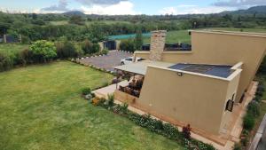 an aerial view of a house with a yard at Blooming Sanctuary in Ruiru