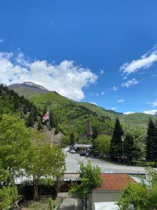 a view of a town with a mountain at Konstanta in Lentekhi +15 photos