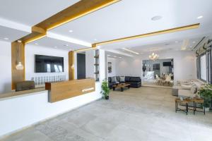 a living room with a couch and a table at Tropicana Hotel Mykonos in Paradise Beach