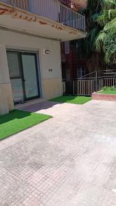 a house with a walkway in front of a patio at dante 55 in Agrigento