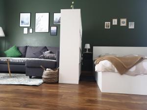 a living room with a couch and a table at Apartma Thermos in Krapinske Toplice