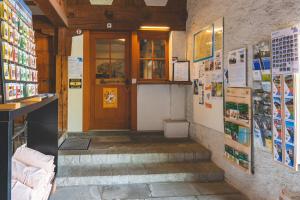 a front door of a building with a staircase at Brugg Youth Hostel in Brugg