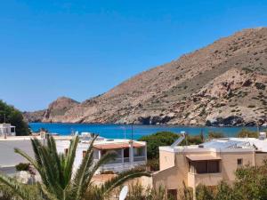 a house with a view of a body of water at Seaview Apartment in Galissas - Blue Lagoon Complex A9 in Galissas