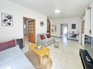a living room with a couch and a table at Casa Maruca with Roque Nublo view in Tejeda