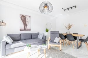 a living room with a couch and a table at Calpe Bay Masnou 24 in Calpe