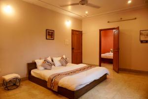 a bedroom with a large bed in a room at Wanderpals Guwahati in Guwahati