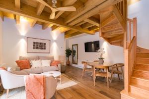 a living room with a couch and a table at Apartamentos La Botica in Comillas
