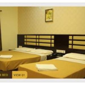 Postel nebo postele na pokoji v ubytování Hotel M.P Temples Inn