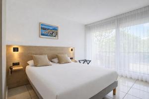 Hotel Centre Plage में एक कमरे में एक या कई बेड +21 फ़ोटो