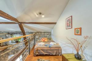 a bedroom with a bed in a room at Tourist Farm Pri Živcovih in Dutovlje