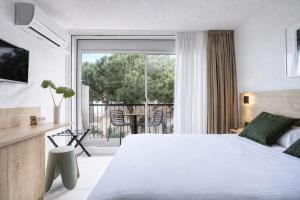 Hotel Centre Plage में एक कमरे में एक या कई बेड
