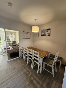 a dining room with a table and chairs at Ferienhaus 1260 in Tossens in Tossenserdeich