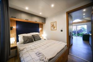 a bedroom with a large bed in a room at Domek Klara in Wałbrzych