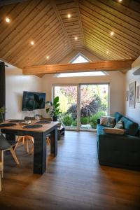 a living room with a couch and a table at Domek Klara in Wałbrzych