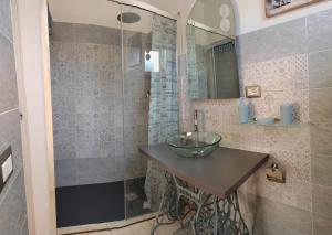 a bathroom with a sink and a shower at B&B Relax Gonone in Cala Gonone +40 photos