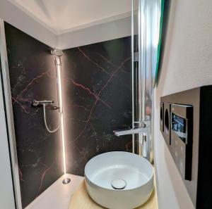 a bathroom with a white sink on a counter at Jagdhotel am Strehlesee in Wandlitz