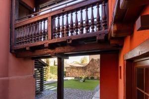 an external view of a house with a balcony at Hotel Le Colombier Suites in Colmar
