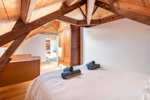 a bedroom with a bed with two pillows on it at Maison de famille au coeur de son vignoble in Lorignac +59 photos