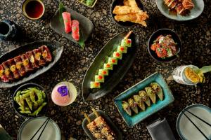 a table topped with plates of food and appetizers at Malmaison Brighton in Brighton & Hove