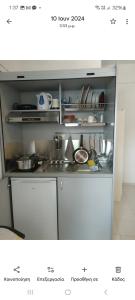 a kitchen with a stove and some pots and pans at Avra in Alonnisos