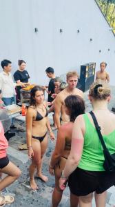 a group of people in bathing suits at a beach at Lotus Premium Lodge in Ha Giang