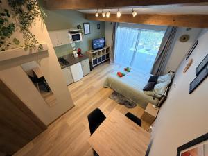 an overhead view of a living room and kitchen in a apartment at Studio avec jardin privé et parking gratuit in Mudaison