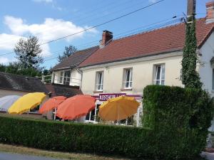 a group of umbrellas in front of a building at Entre 2 Rives in Charly-sur-Marne