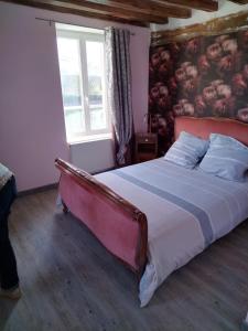 a bedroom with a large bed and a window at Entre 2 Rives in Charly-sur-Marne