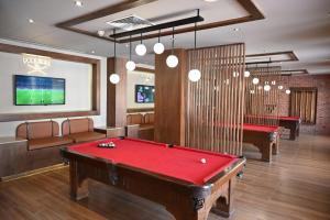 a billiard room with a red pool table at Sharm Hills Elite Suite in Sharm El Sheikh