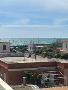 a view of the ocean from the roof of a building at Portunno Relax House in Fiumicino