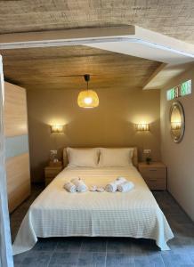 a bedroom with a bed with towels on it at Hill House in Kavála