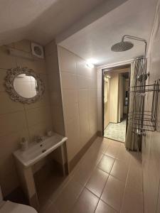 a bathroom with a sink and a mirror at Hill House in Kavála +24 photos