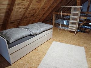 a bedroom with a bed in a attic at Ferienwohnung Landlust in Treuchtlingen