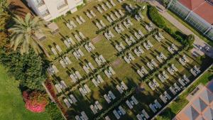 an aerial view of a large apartment complex with a palm tree at Medplaya Hotel Pez Espada in Torremolinos