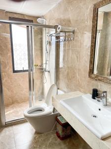 a bathroom with a toilet and a sink at Song Nga Boutique Hotel Cat Ba in Cat Ba +28 photos