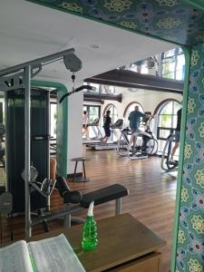 a gym with people exercising in the gym at Exclusive Condo with Pool - Self Check-in in Hua Hin