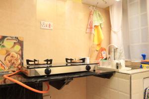 a stove on a counter in a kitchen at BomaZuri Homestays Tala in Nguluni +37 photos