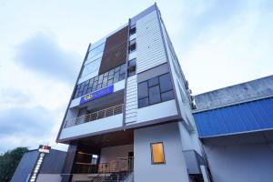 a building with a sign on the front of it at FabHotel A Square - 400m from Bhimavaram Junction in Bhīmavaram