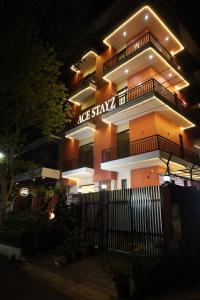 a large building with a sign on the side of it at Ace Stayz - Boutique Hotel Near DLF Mall Sector 45, Noida in Noida