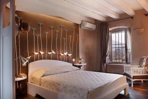 Boutique Hotel Villa dei Campi tesisinde bir odada yatak veya yataklar
