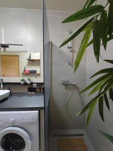 a laundry room with a washer and dryer at Le Châlet Nature de Lieurey in Lieurey +15 photos