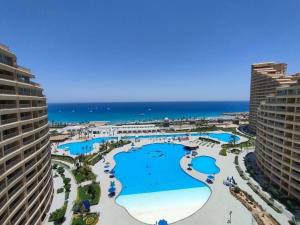 an aerial view of the pool at the resort at اهرمات بورتو السخنه in Madinaty +16 photos