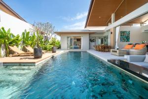 an infinity pool in a villa with a house at Wila villas Phuket Free Airoport Pick up from 7 days in Phuket